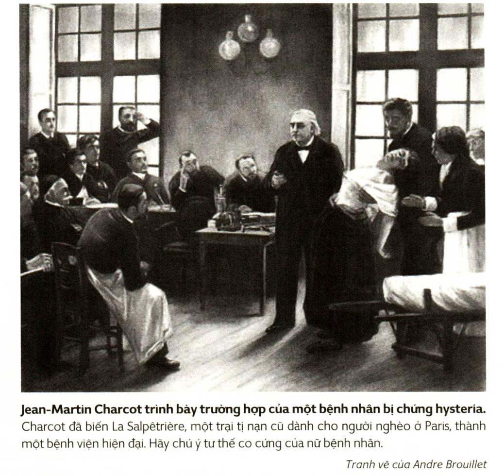 A person standing in front of a group of people sitting at desks Description automatically generated with medium confidence